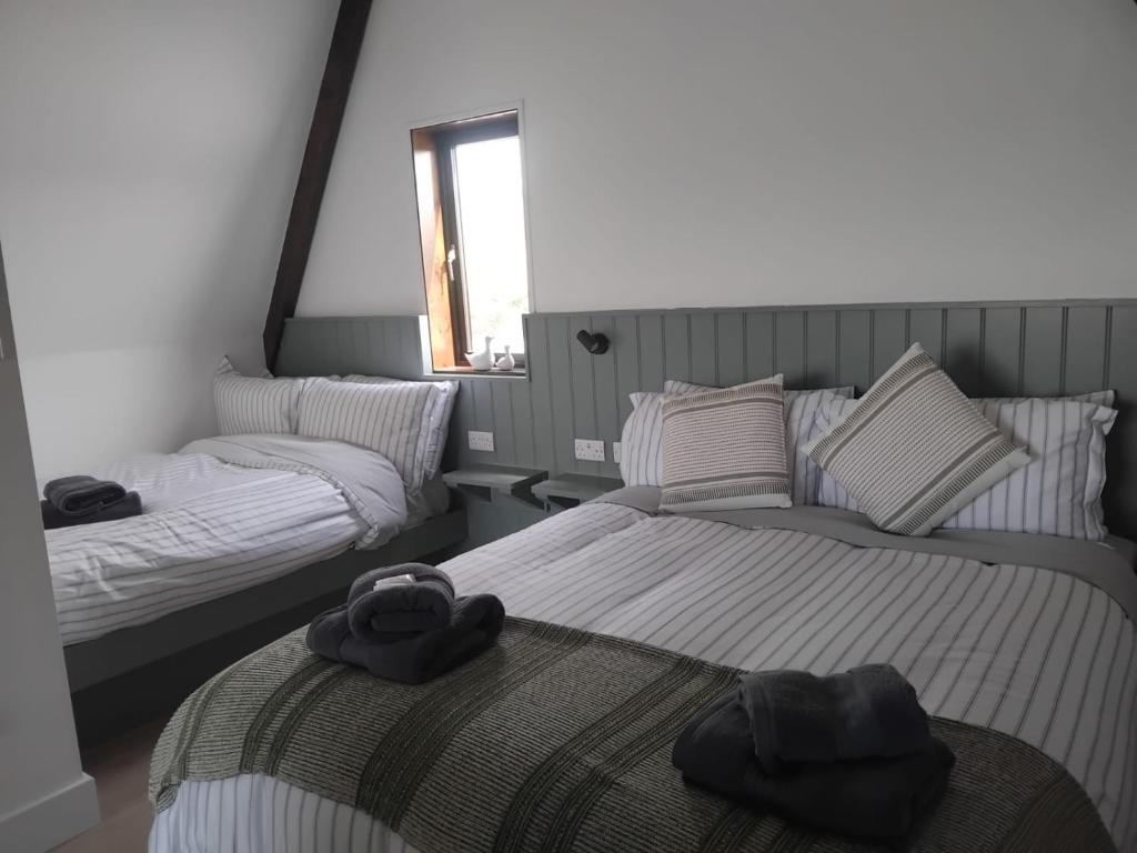 Postel nebo postele na pokoji v ubytování Wild Atlantic Pods