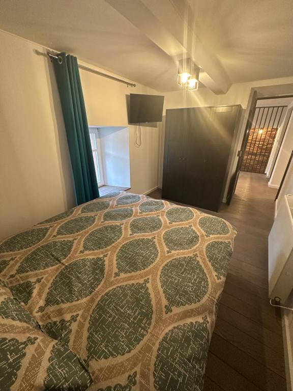 Postel nebo postele na pokoji v ubytování UrbanNEST