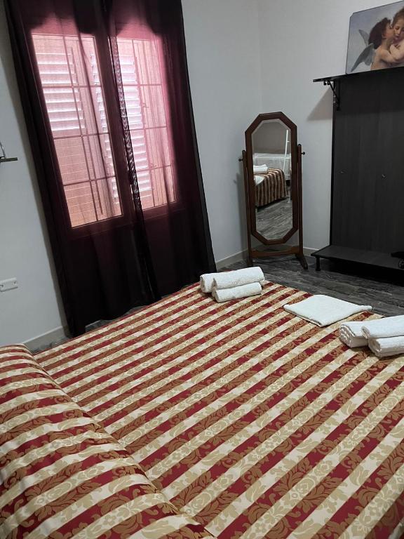 Postel nebo postele na pokoji v ubytování B&B Andromeda