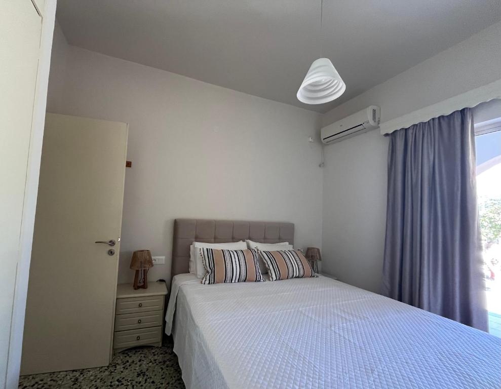 Letto o letti in una camera di Nikos Studios