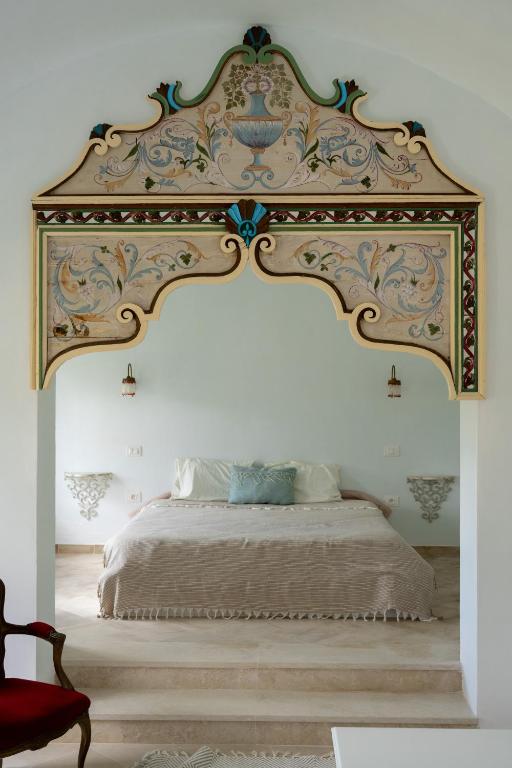 Rúm í herbergi á Dar Kalitoussa B&B Hammamet