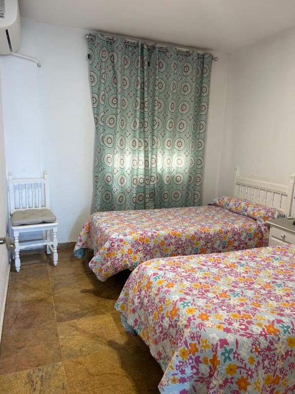 Posteľ alebo postele v izbe v ubytovaní APARTAMENTO FRENTE AL MAR,PRIMERA LINEA DE PLAYA