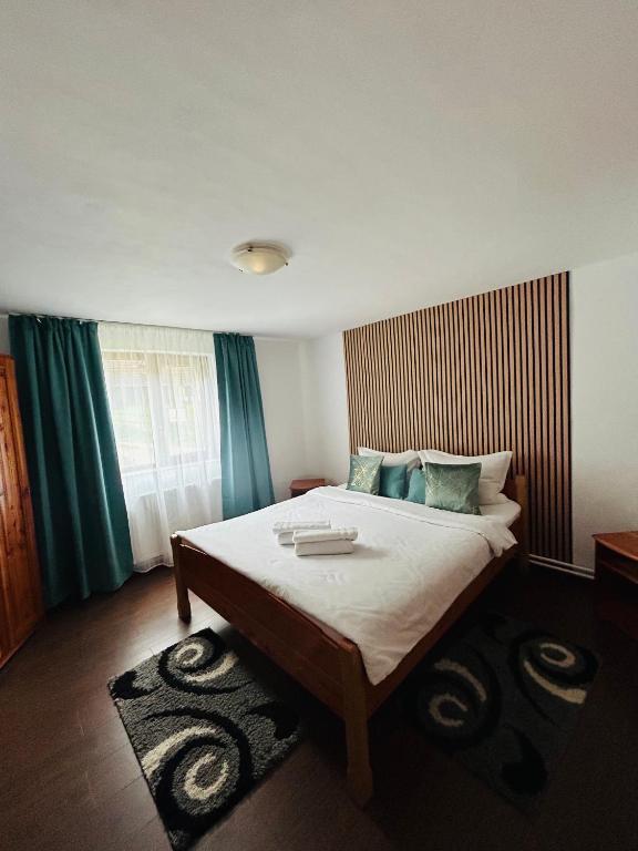 Postel nebo postele na pokoji v ubytování Casa Ursu