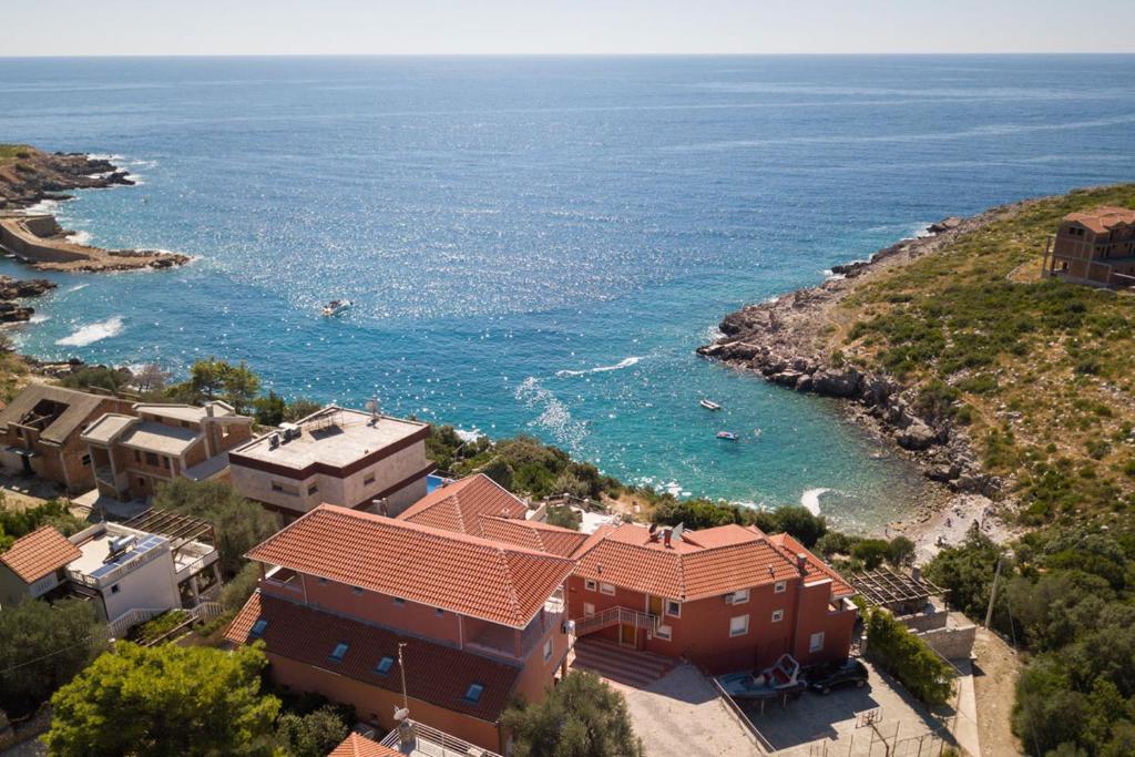 an aerial view of a house and the ocean at Apartment Veslo in Begovići