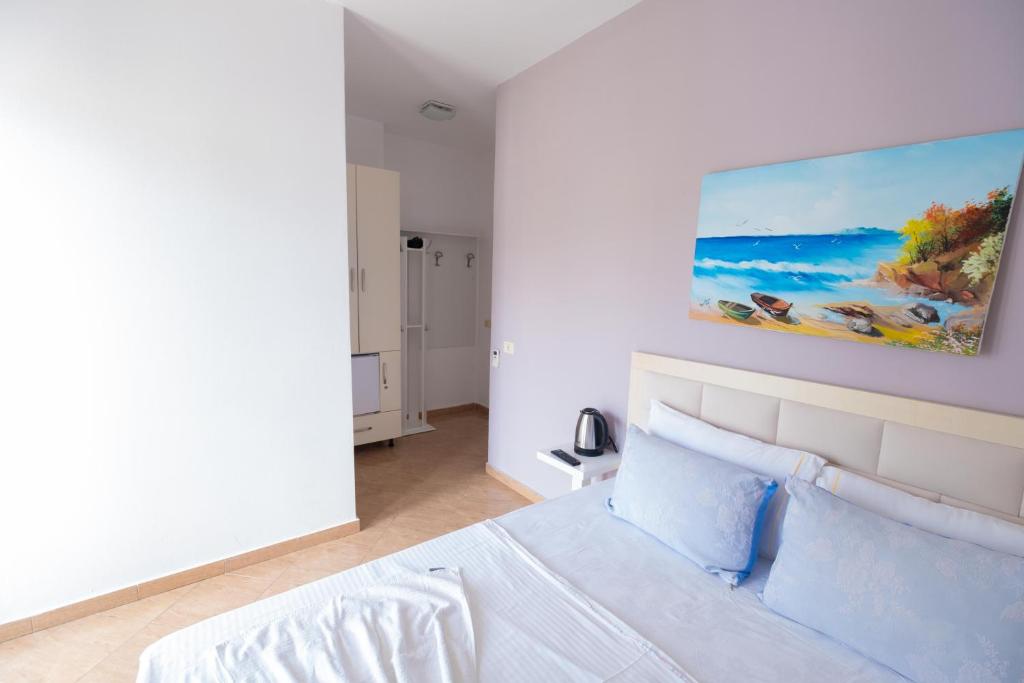 Postel nebo postele na pokoji v ubytování Sun Shine Hotel