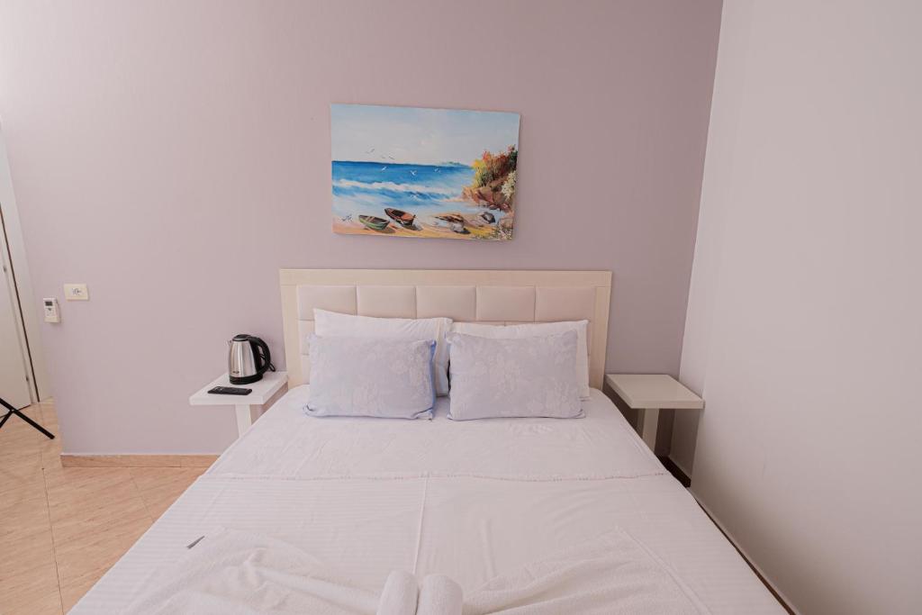 Postel nebo postele na pokoji v ubytování Sun Shine Hotel