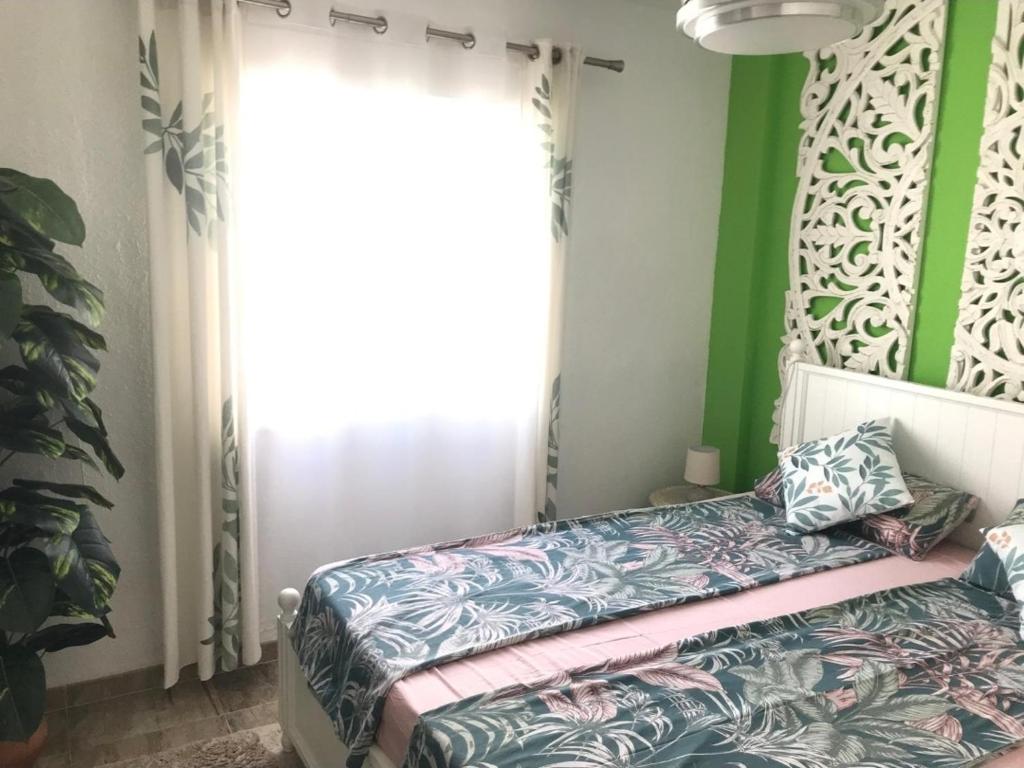 Łóżko lub łóżka w pokoju w obiekcie Casa Sol y Luna