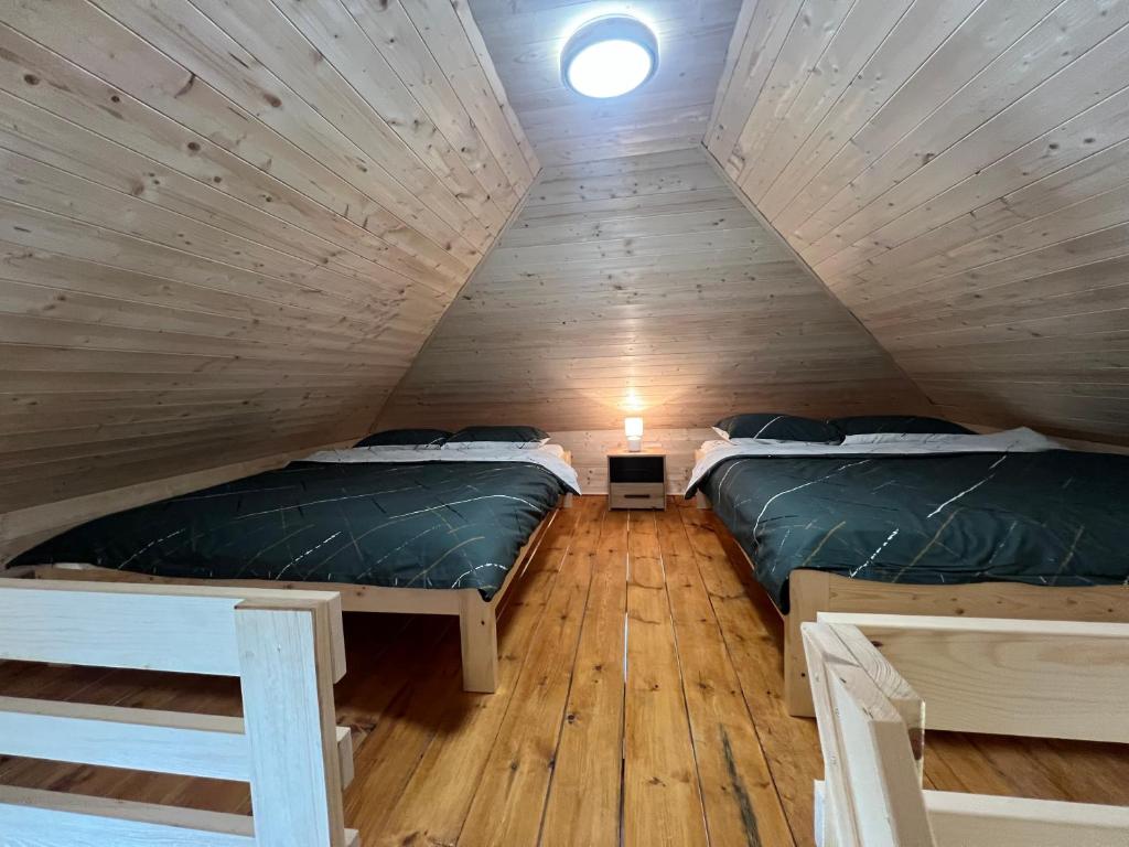 Postel nebo postele na pokoji v ubytování Etno selo EKO POGLEDI