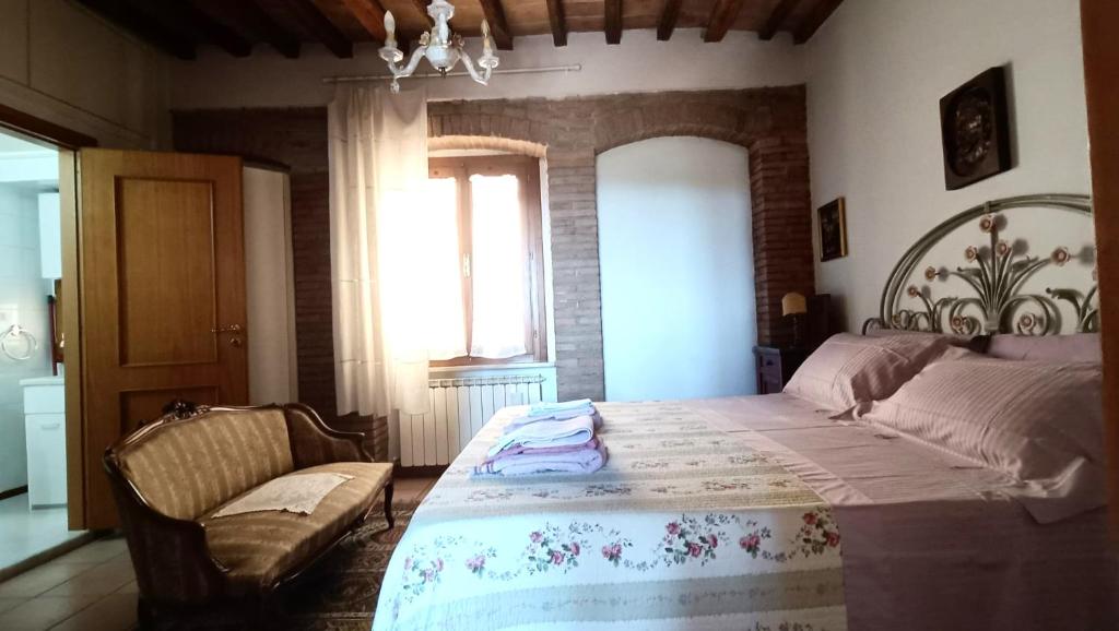 Łóżko lub łóżka w pokoju w obiekcie Centro Storico Perugia - Vista Su Assisi