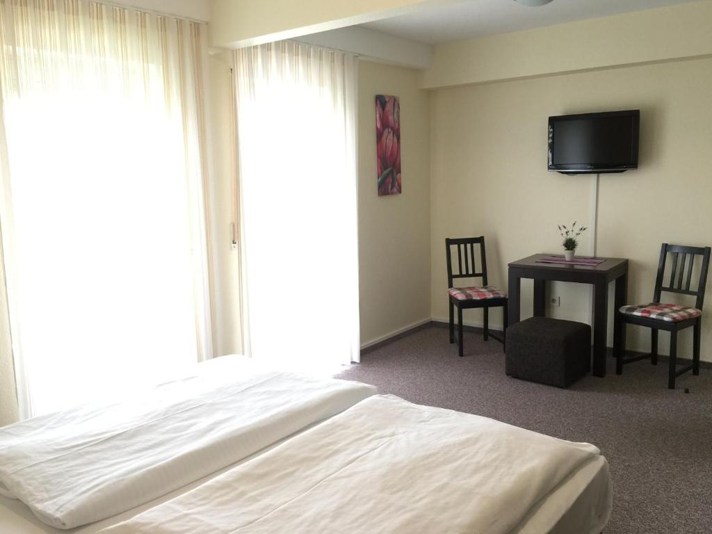 Postel nebo postele na pokoji v ubytování Hotel Gasthof am Waldeck