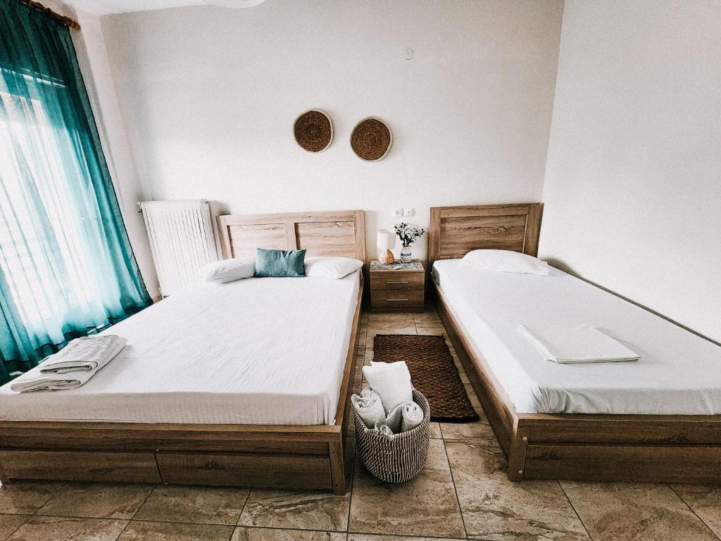 Postel nebo postele na pokoji v ubytování Aktaion Hotel