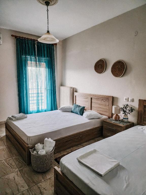 Postel nebo postele na pokoji v ubytování Aktaion Hotel