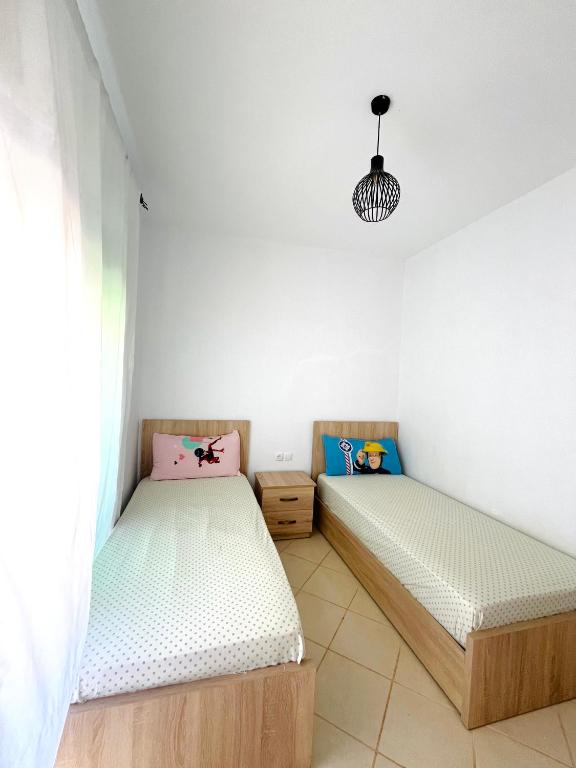 Postel nebo postele na pokoji v ubytování Appartement centre oued laou avec piscine été