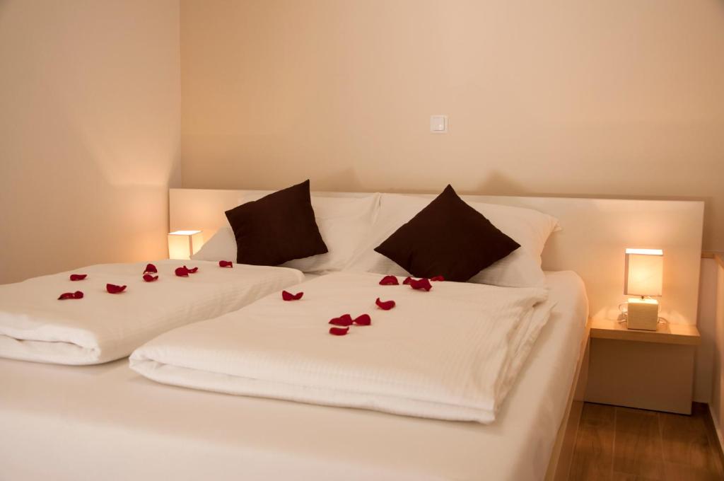 Postel nebo postele na pokoji v ubytování Guest House Bulevar