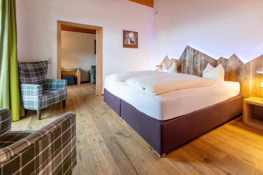 Postel nebo postele na pokoji v ubytování Hotel Seelos
