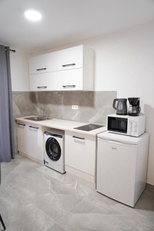 A kitchen or kitchenette at Old Town Studios, Corfu