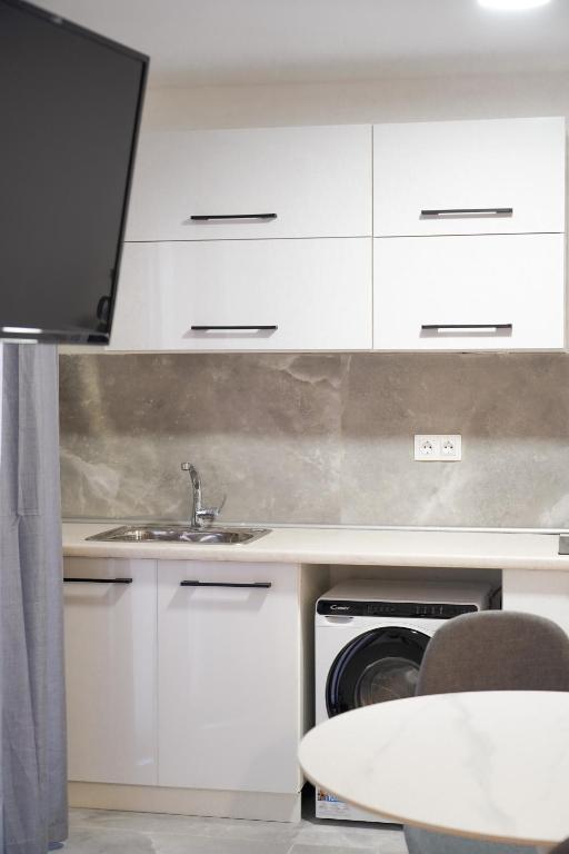 A kitchen or kitchenette at Old Town Studios, Corfu