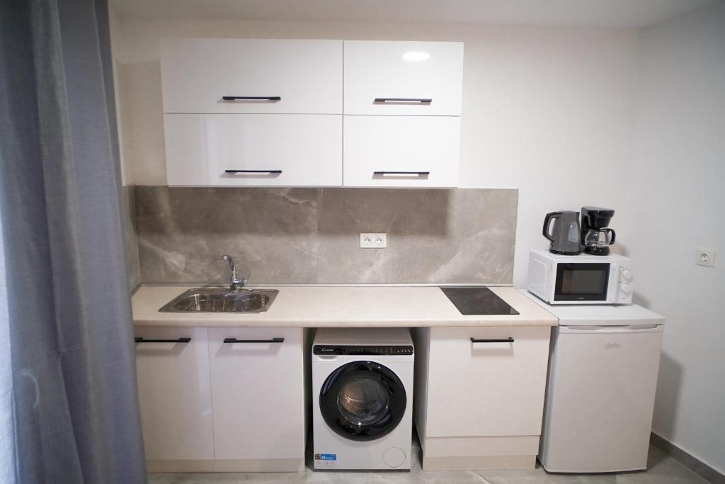 A kitchen or kitchenette at Old Town Studios, Corfu