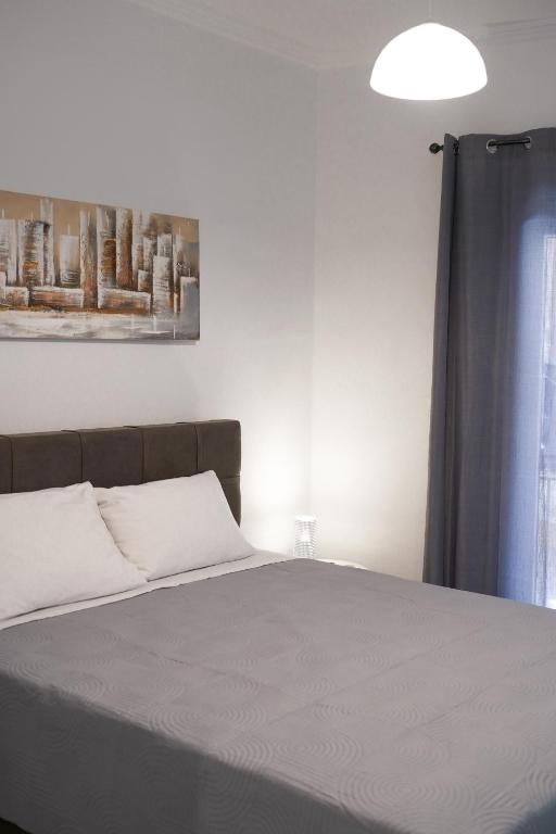 A bed or beds in a room at Old Town Studios, Corfu