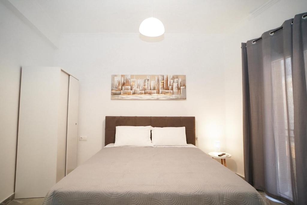 A bed or beds in a room at Old Town Studios, Corfu