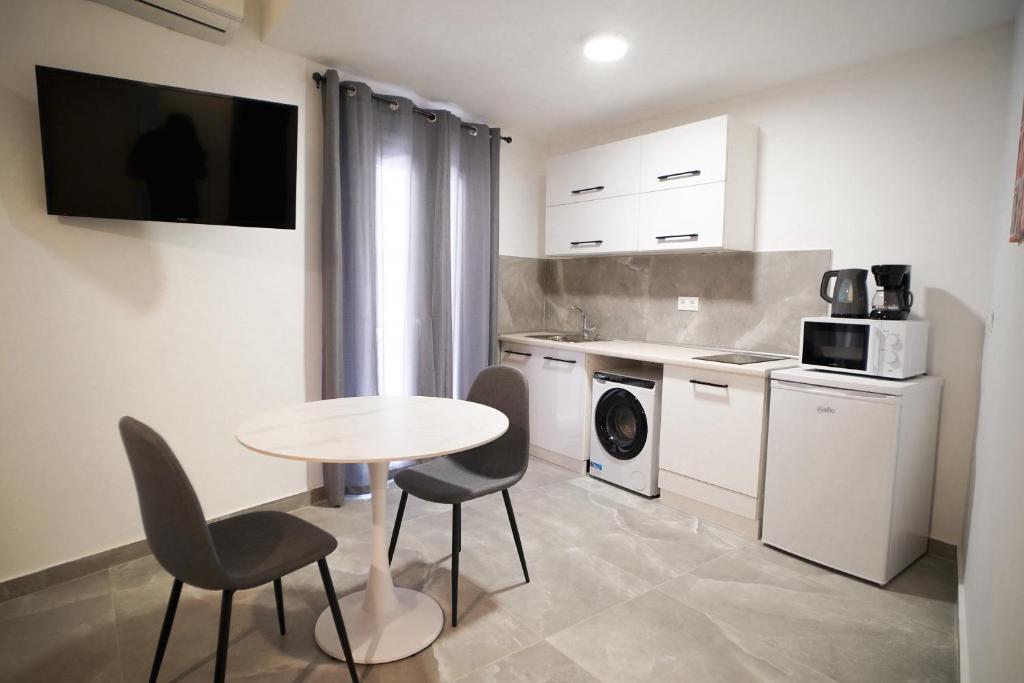 A kitchen or kitchenette at Old Town Studios, Corfu