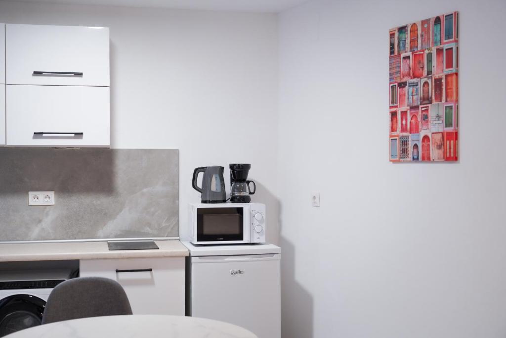 A kitchen or kitchenette at Old Town Studios, Corfu