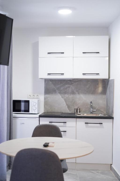 A kitchen or kitchenette at Old Town Studios, Corfu