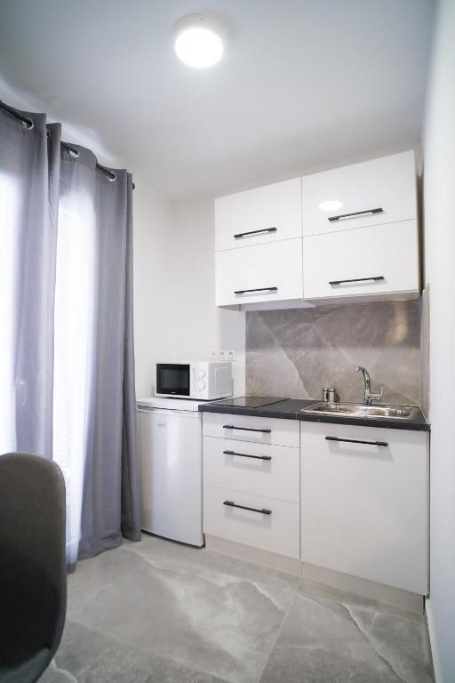 A kitchen or kitchenette at Old Town Studios, Corfu
