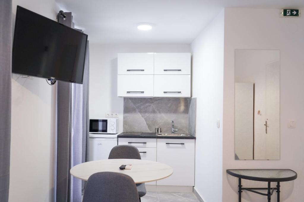 A kitchen or kitchenette at Old Town Studios, Corfu