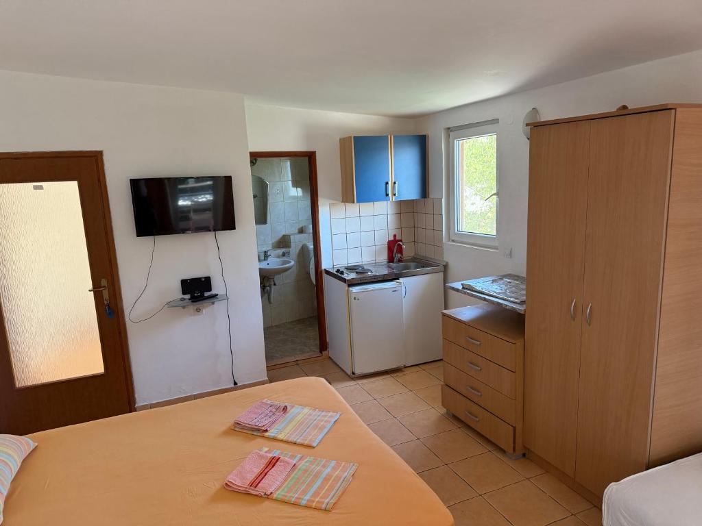 Kuchyň nebo kuchyňský kout v ubytování Apartments Vretenicic