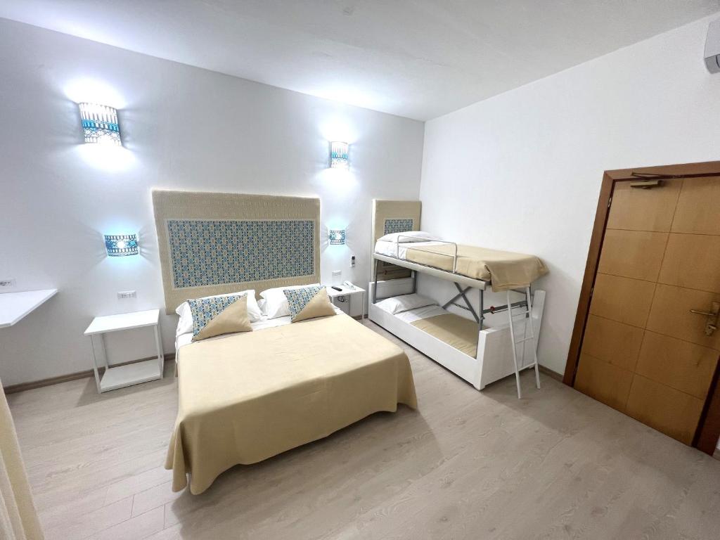 Postel nebo postele na pokoji v ubytování Hotel Da Cecco