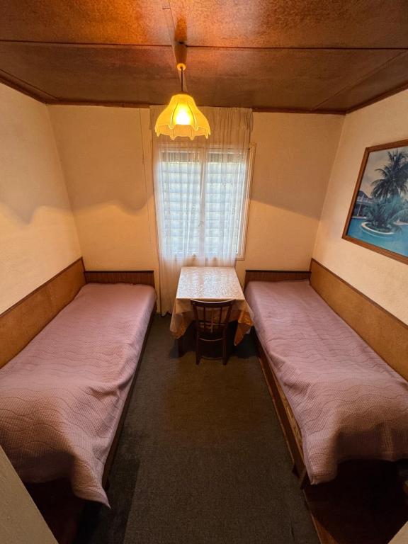 Postel nebo postele na pokoji v ubytování Kosmos