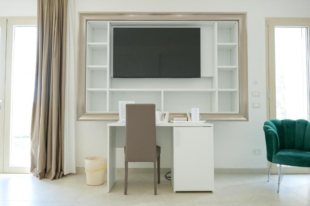 TV a/nebo společenská místnost v ubytování Masseria Pozzelle