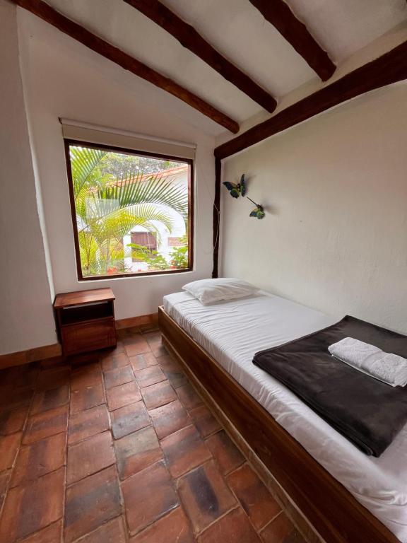 Postel nebo postele na pokoji v ubytování Eco-Lodge Barichara