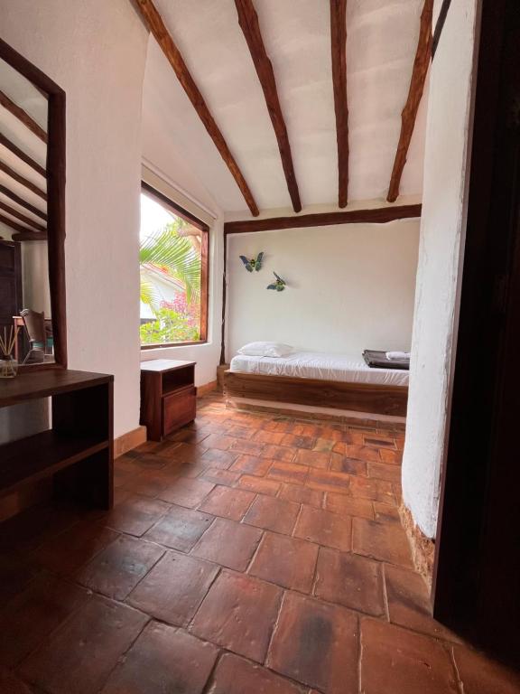 Postel nebo postele na pokoji v ubytování Eco-Lodge Barichara