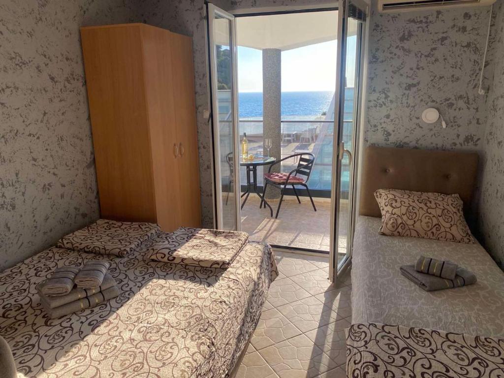 Postel nebo postele na pokoji v ubytování Apartments Mekic