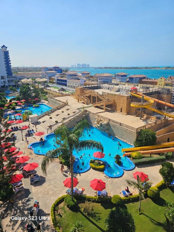 an aerial view of a pool at a resort at porto marina 3 in El Alamein