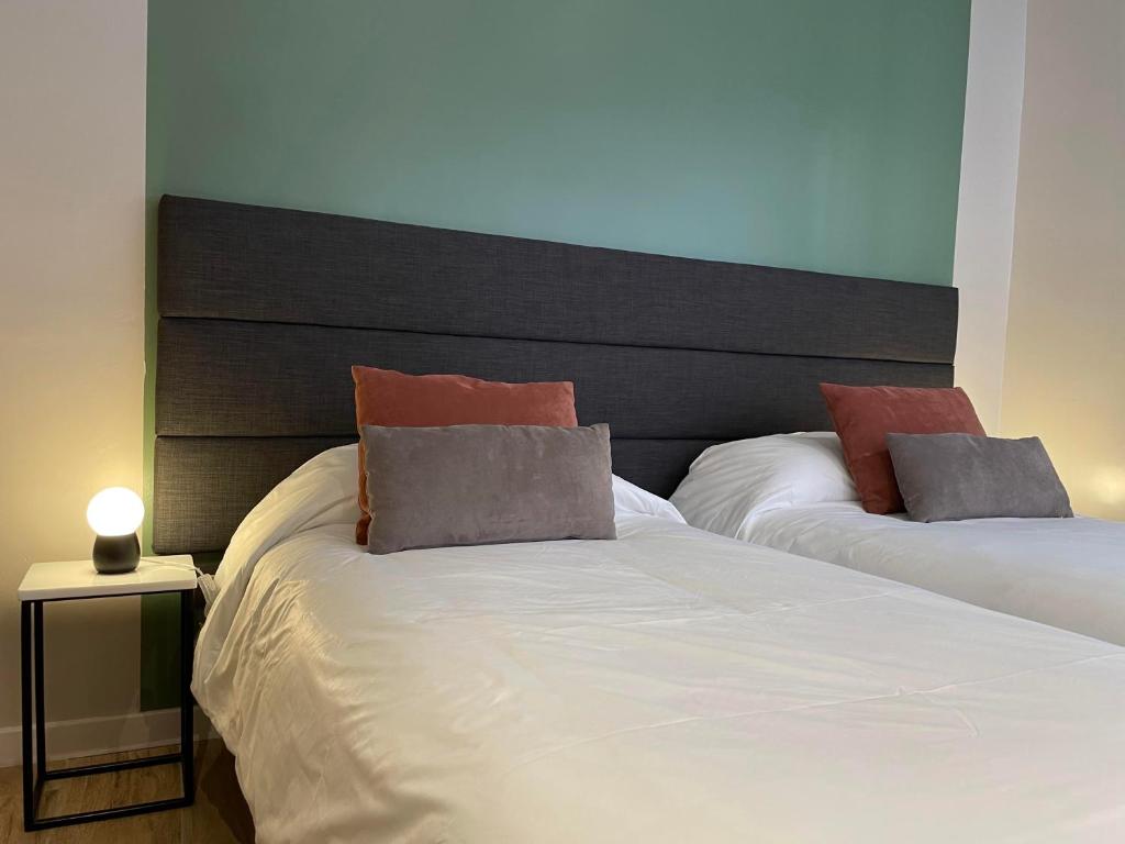 Postel nebo postele na pokoji v ubytování Huli B&B