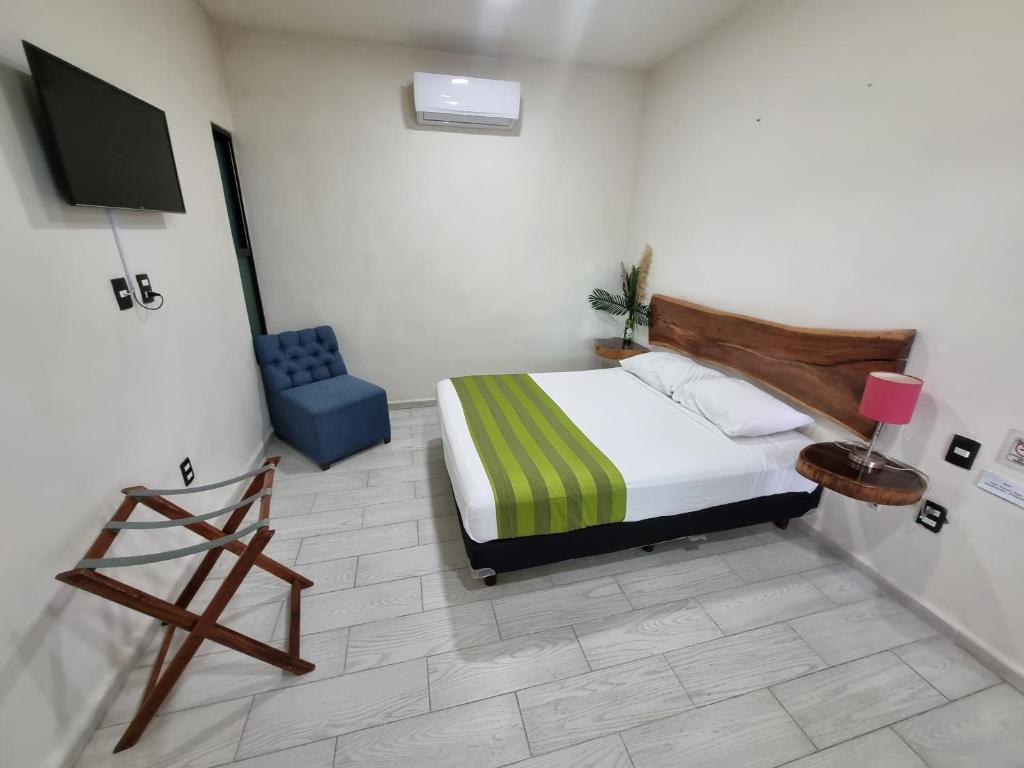 Postel nebo postele na pokoji v ubytování Hotel Brisas Bacalar