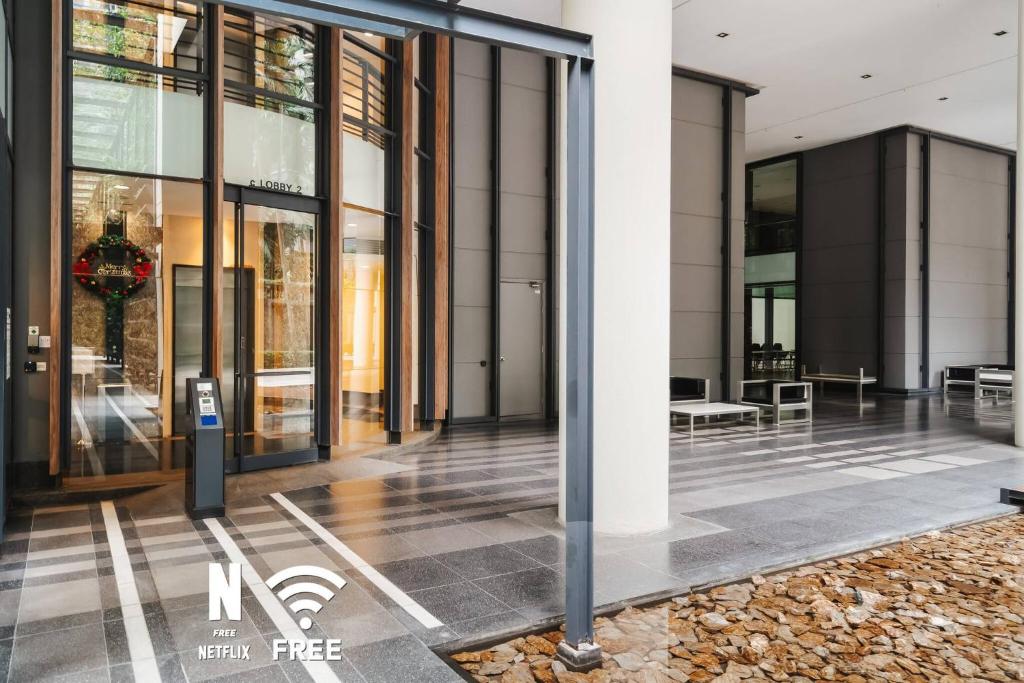 a view of a building with glass doors at Designer Luxury 3BR Retreat near Pavilion & KLCC in Kuala Lumpur