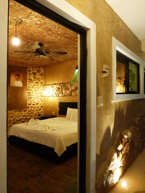Postel nebo postele na pokoji v ubytování Habitaciones Colonial Zaci