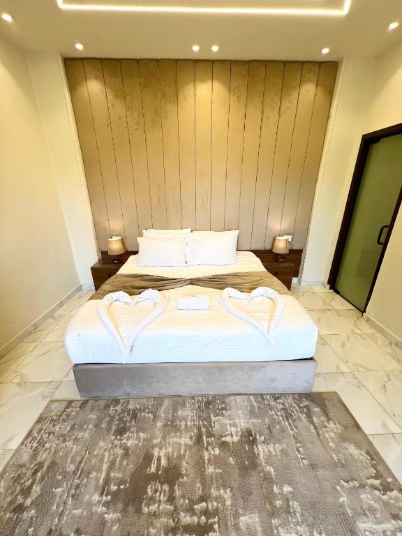 Postel nebo postele na pokoji v ubytování Pyramids Umbrella Hotel