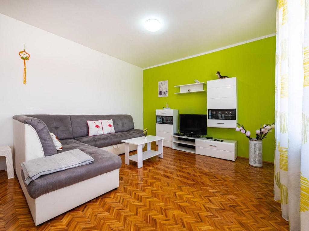 a living room with a couch and a table at Five Bedroom Villa in Zadar