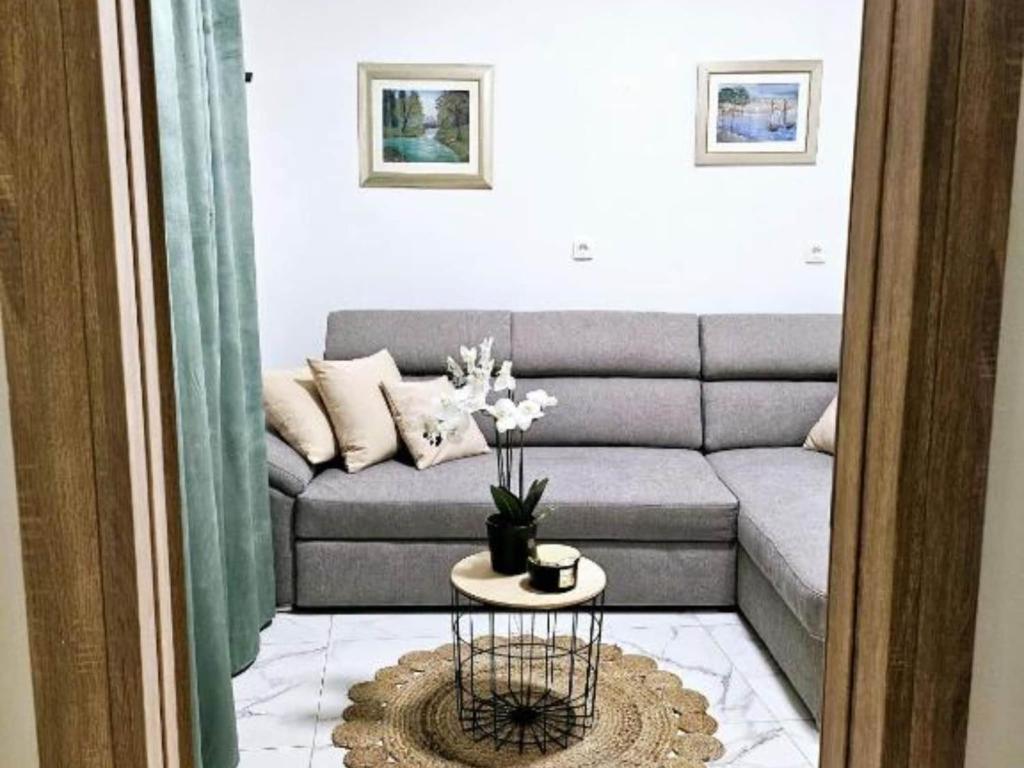 a living room with a couch and a table at Villa Nika - Three Bedroom Villa with Private Pool in Lozovac