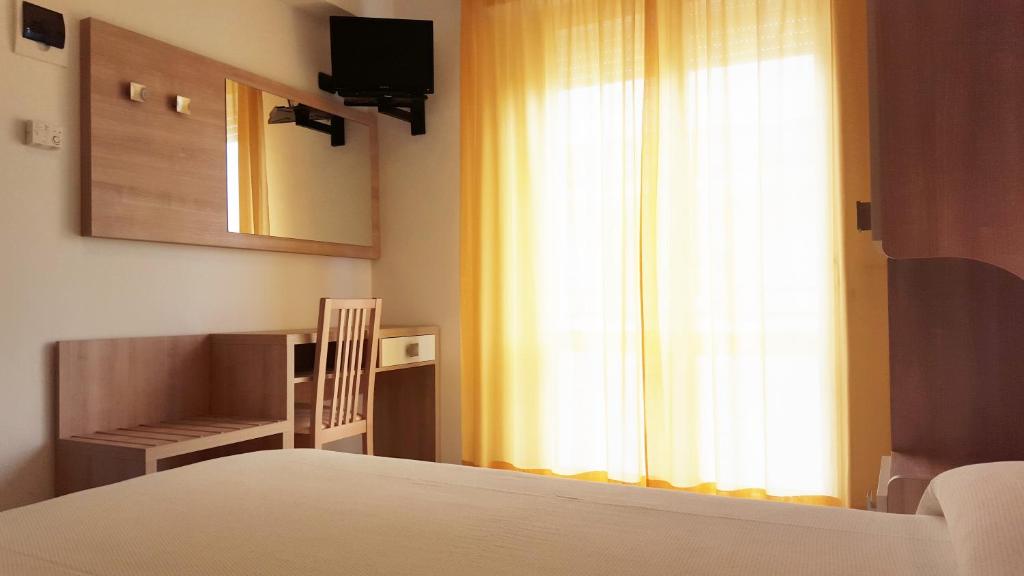 Postel nebo postele na pokoji v ubytování Hotel Trocadero