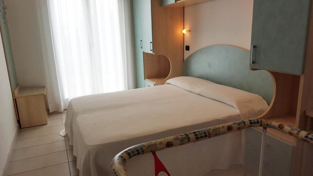 Postel nebo postele na pokoji v ubytování Hotel Trocadero