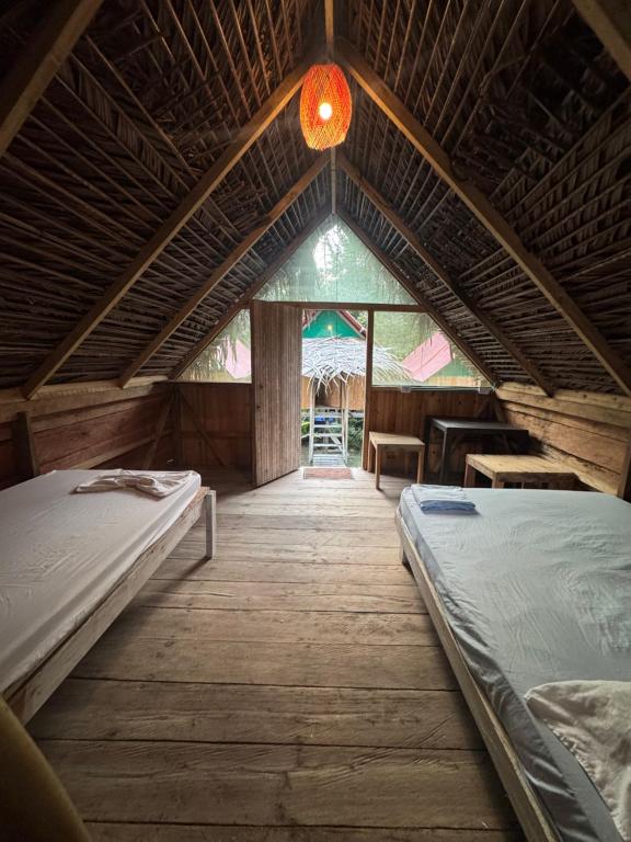 Postel nebo postele na pokoji v ubytování SURF HOUSE ESTILO LIBRE