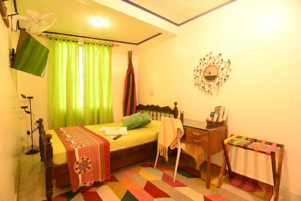 Postel nebo postele na pokoji v ubytování Antigua Hostal