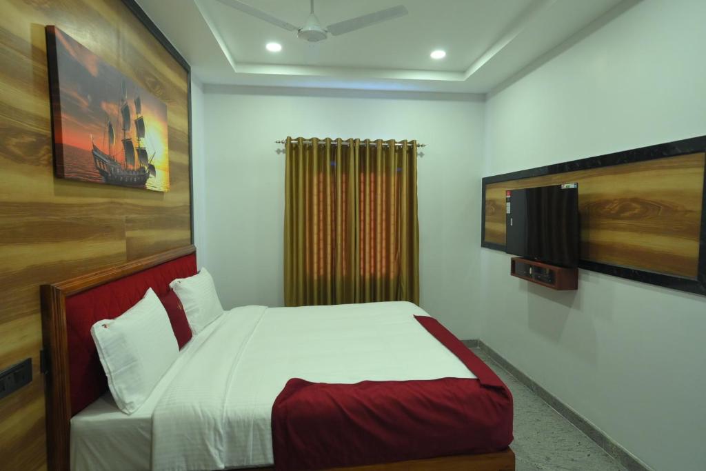Postel nebo postele na pokoji v ubytování Hotel Ramraj Regency