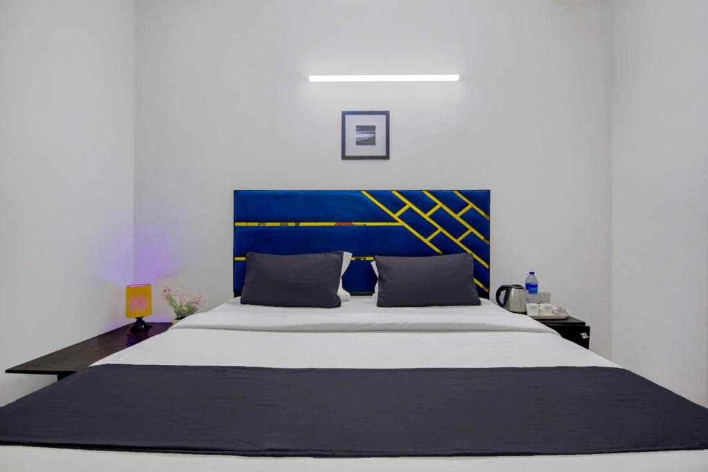 Postel nebo postele na pokoji v ubytování Hotel O Relax Inn